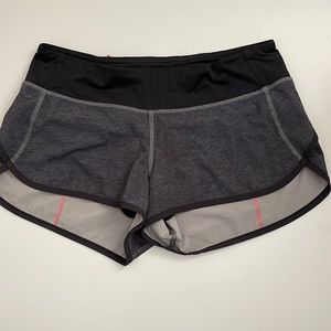Lululemon size 6 speed lined shorts.  Charcoal gray and pink.